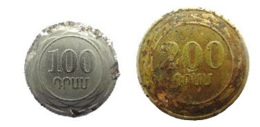 Twisted, flattened coins, but the obverse and the reverse images are preserved